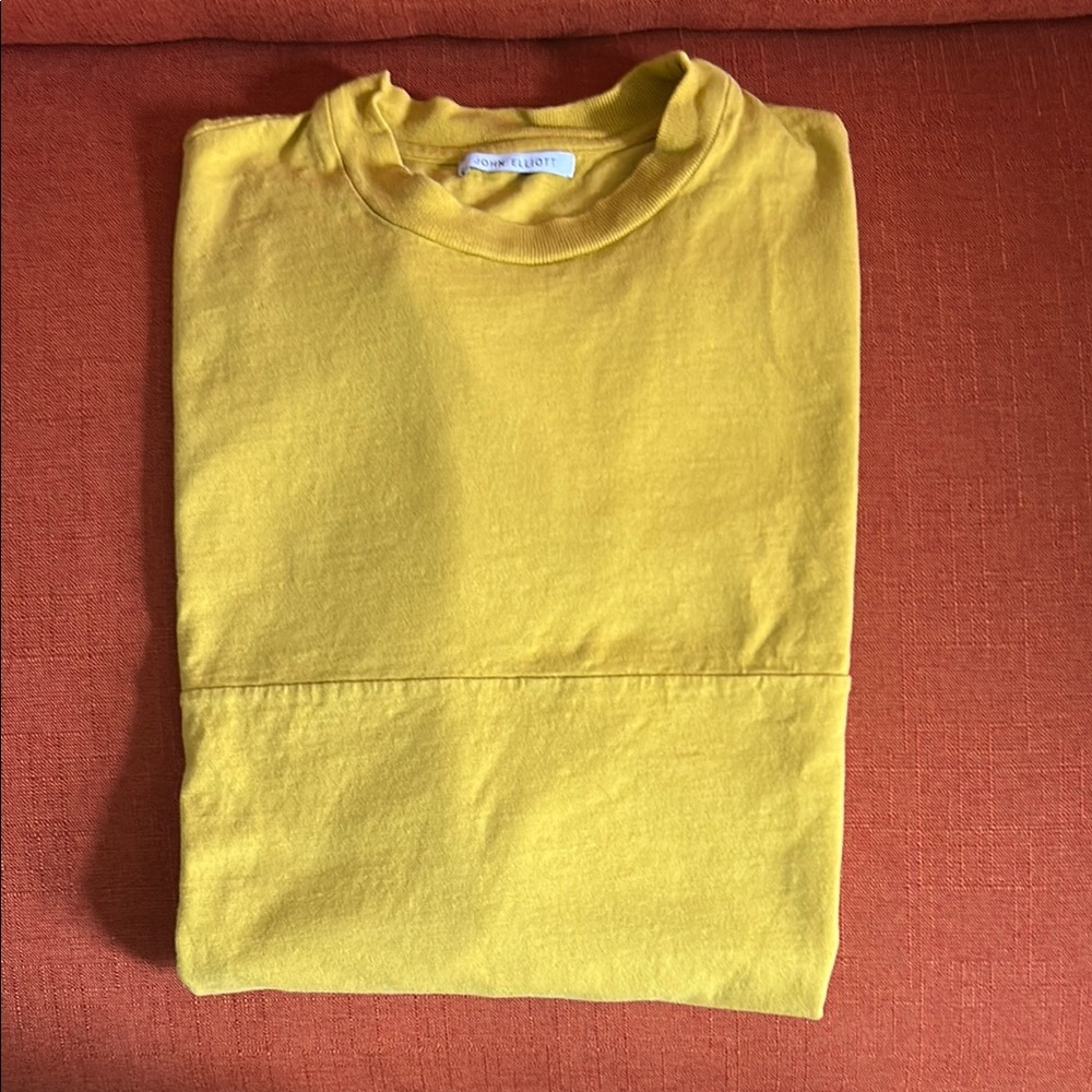 John Elliot distressed tshirt. Color is more like mustard yellow